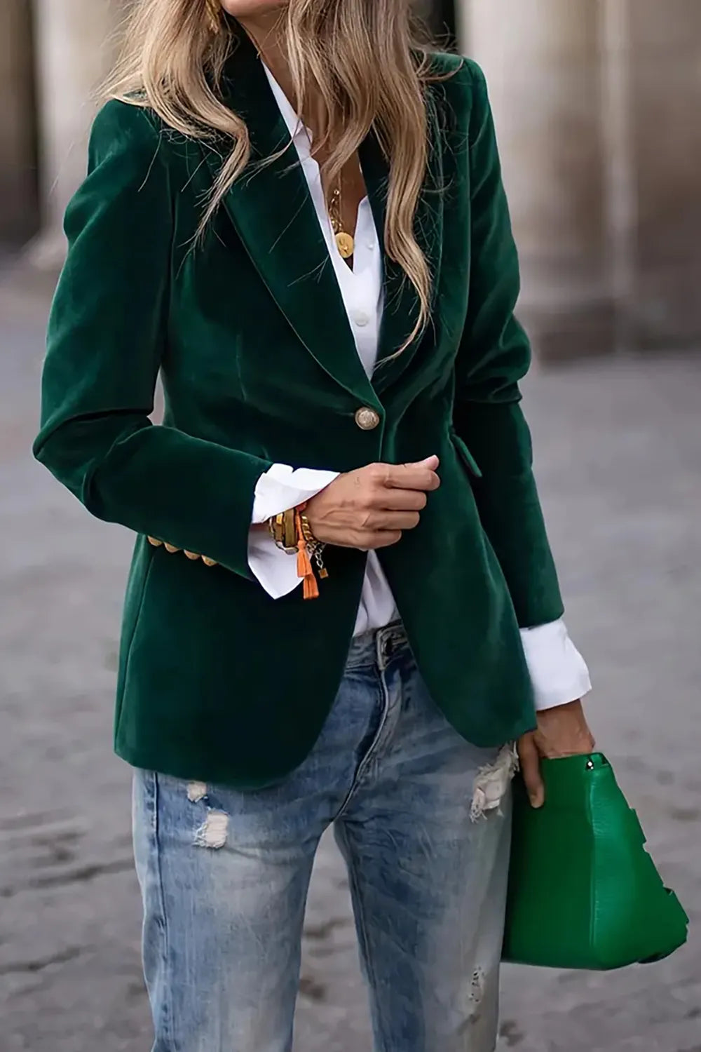 Green one button lapel collar long sleeve blazer with gold button and lined body, styled with white shirt and distressed jeans.