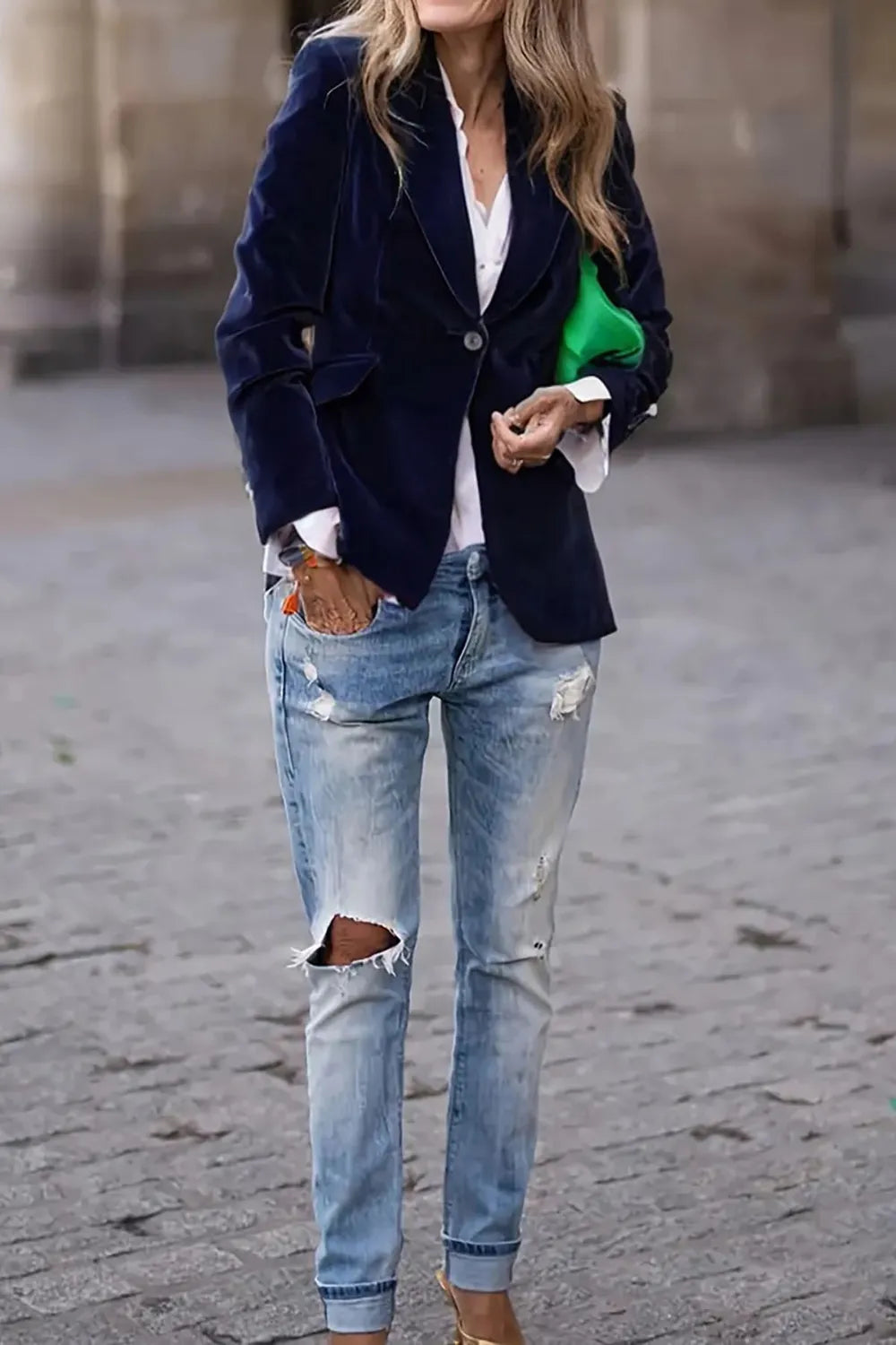 woman wearing navy blue one button lapel collar long sleeve blazer with ripped jeans